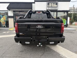 Fleet Safety Solutions on a 2025 Ford F-150 Tremor with Ranch Hand front and rear bumpers, reverse lights, Drone front and rear cameras, and Vigor roll bar installed by Ocala Car Audio