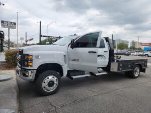 Fleet Safety Solutions - Chevrolet Silverado 5500HD fleet truck at Ocala Car Audio with Stinger HORIZON10 radio, wireless Apple CarPlay, reverse camera, blind spot cameras, dash camera, and strobe lights installed